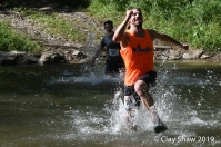 Rich Erdlen of the Flying Feet Racing Team, runs across the water.