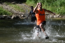 Rich Erdlen of the Flying Feet Racing Team, runs across the water.